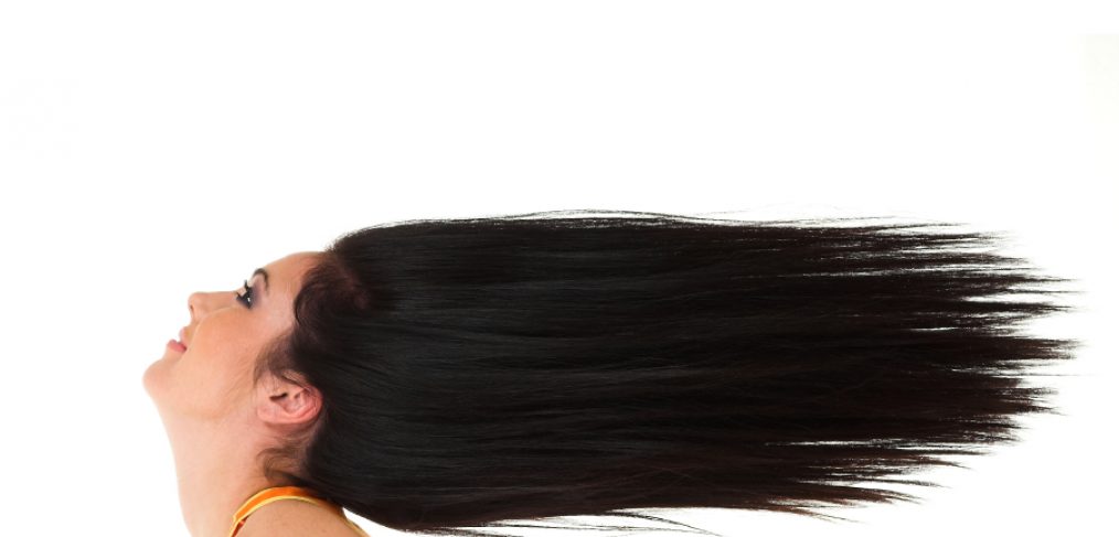 Young girl with beautiful long and healthy brunet hair isolated on white background