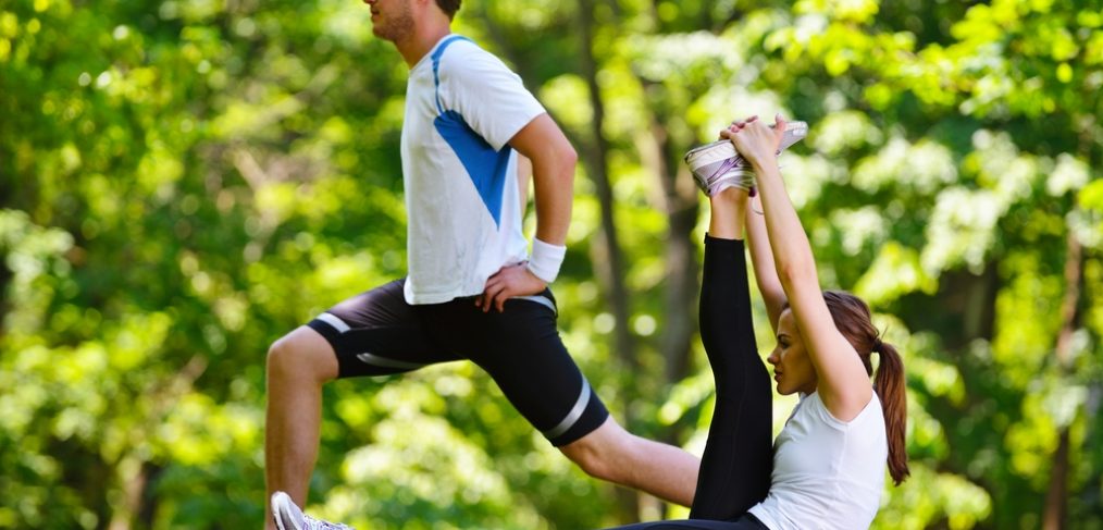 Couple exercising in a park.