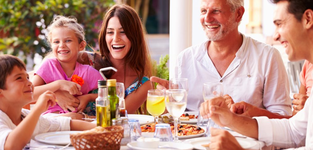 Family having a meal outdoors.