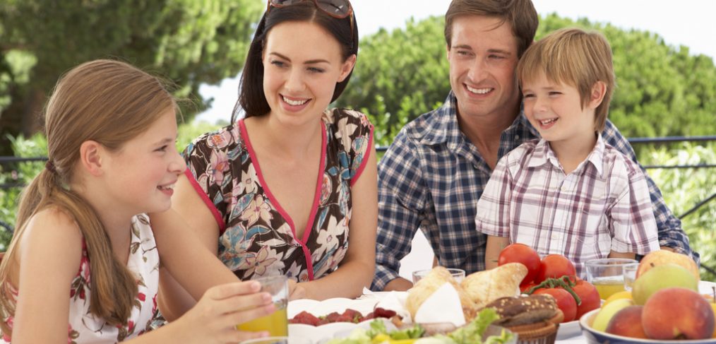 Family enjoying an outdoor picnic