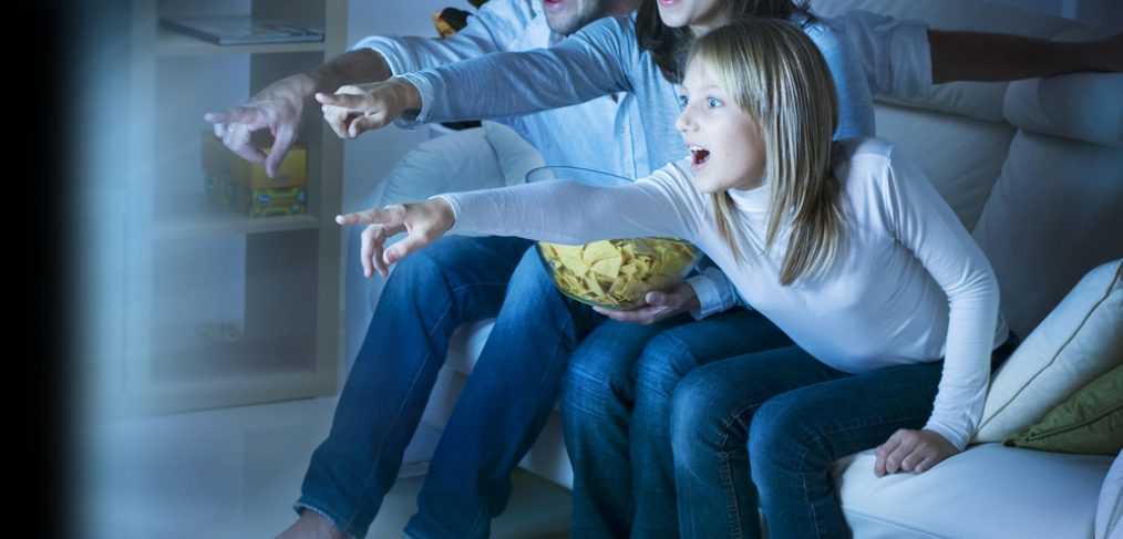 Family watching a movie