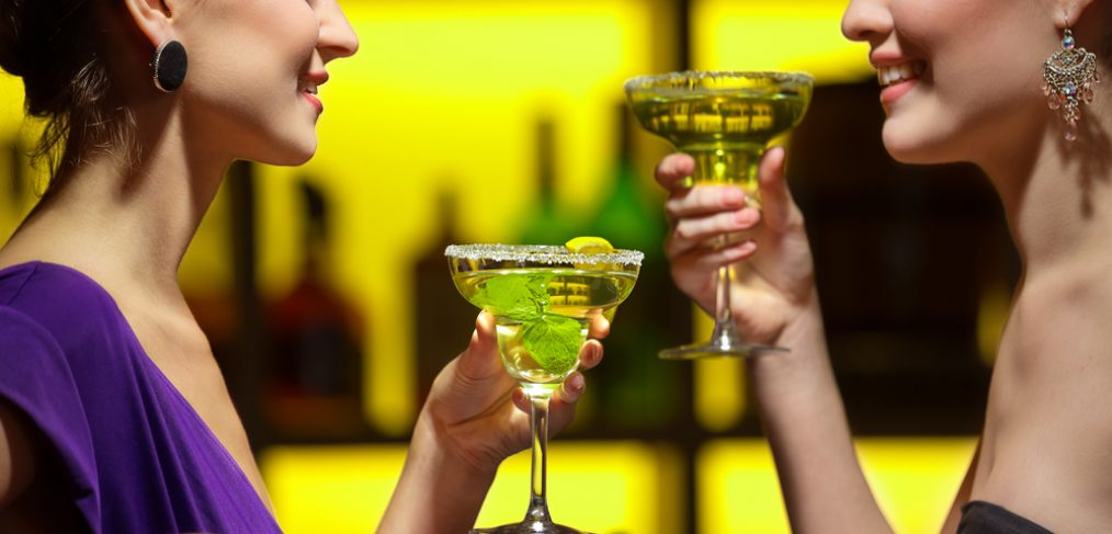 Two women enjoying martinis