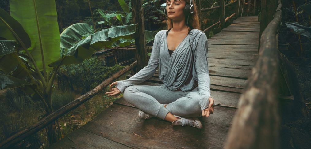 Woman meditating outdoors