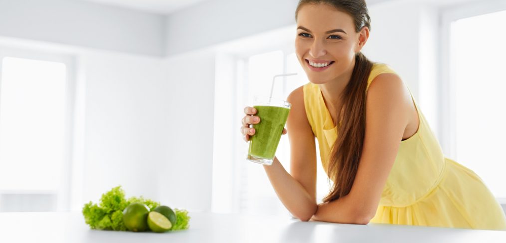 Woman drinking a detox smoothie