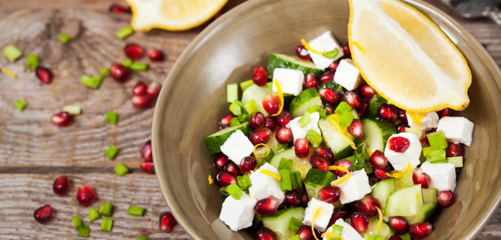 Pomegranate salad on wooden table