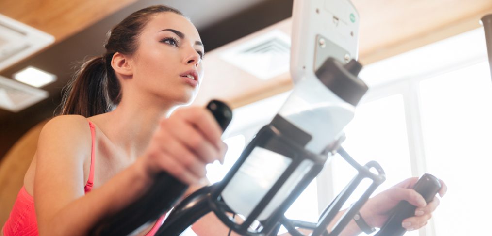 Woman exercising on elliptical