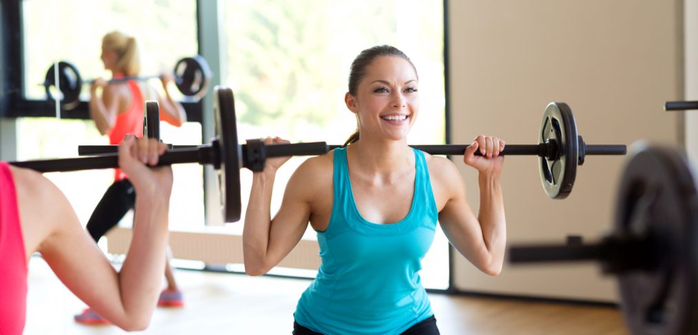 Woman using barbells