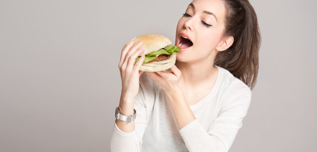Woman eating burger