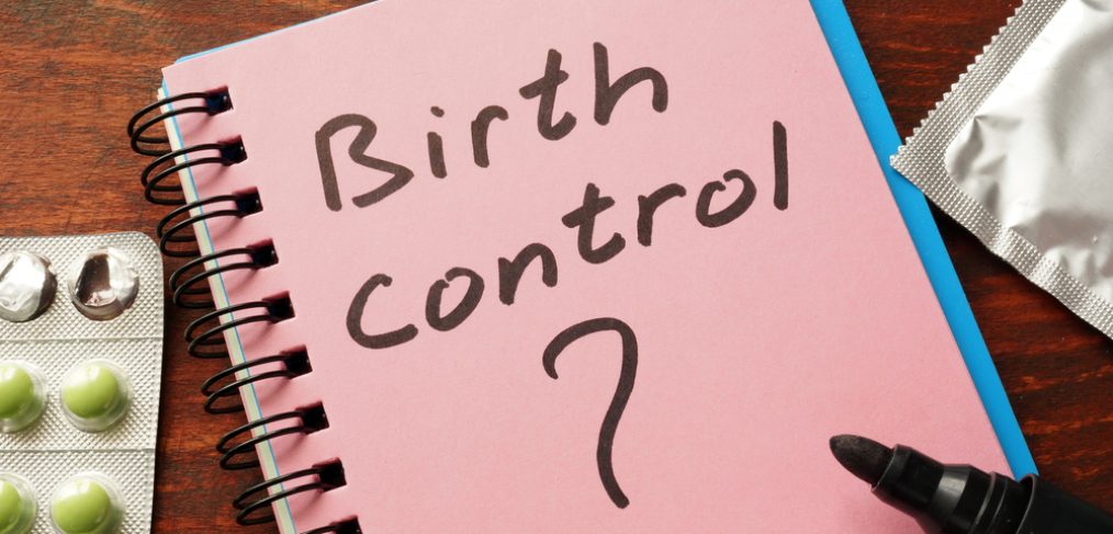 Notebook with the word birth control written on it.