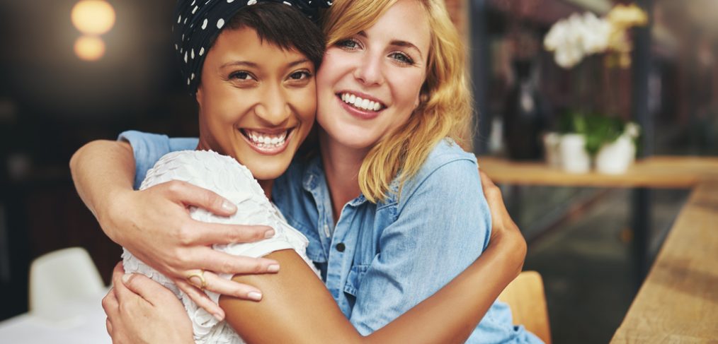 Two female friends hugging