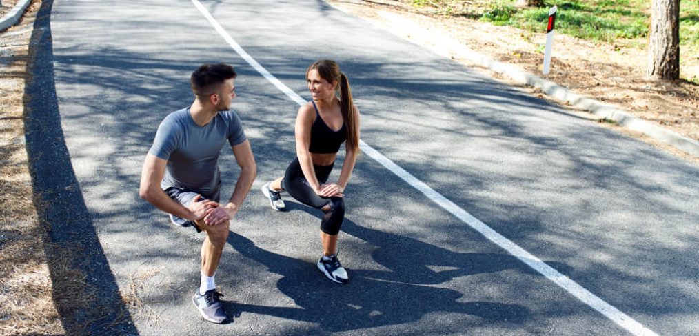 Couple doing walking lunges