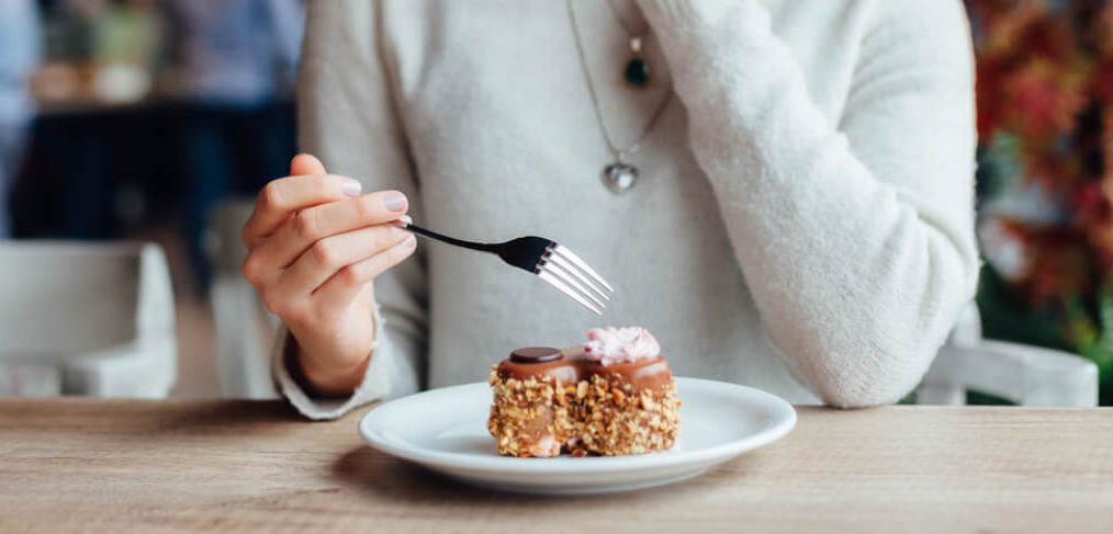 Woman eating carrot cake