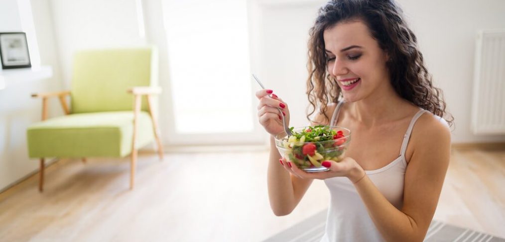 Woman eating healthy salad