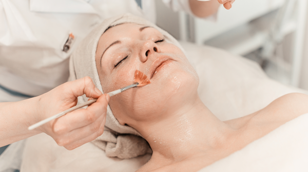 Woman enjoying facial treatment