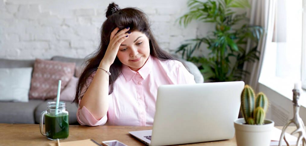 Tired woman at her work desk