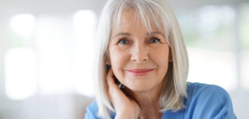 Portrait of smiling mature woman with white hair