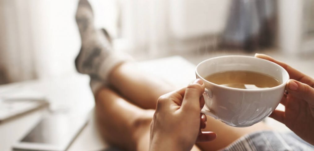 Drinking tea on the couch, with socks on